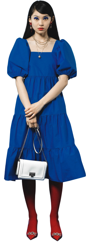young-woman-blue-dress-handbag-standing